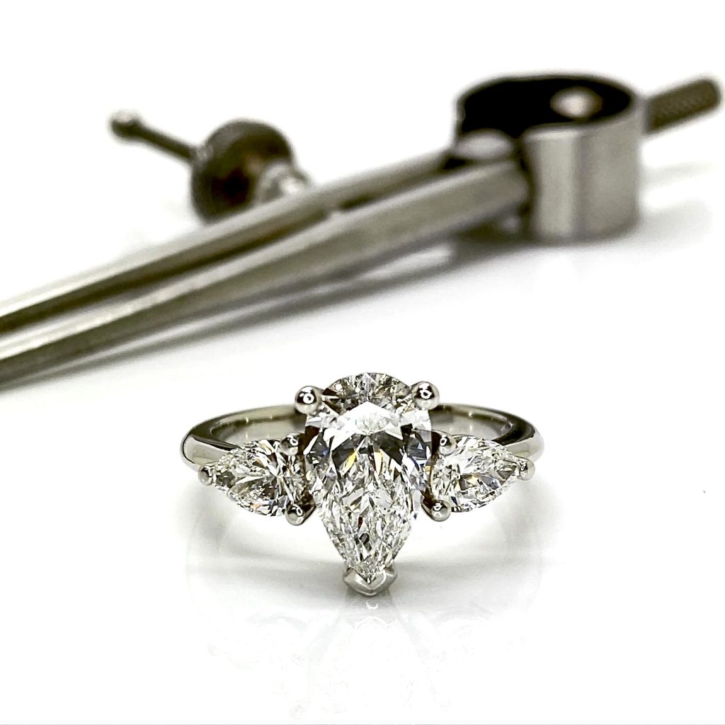 Trilogy pear shape diamond ring.